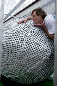 Checking the bottle cap sculpture of a Rugby Ball Checking the bottle cap sculpture of a Rugby Ball - image by Liz March
