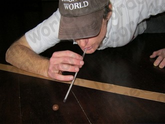 Blowing a malteser with a straw for a Guinness World Record