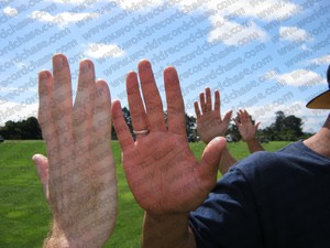 Setting the world record for the most high fives in a minute