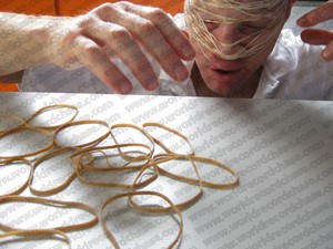 Practising putting rubber bands on my head for another world record